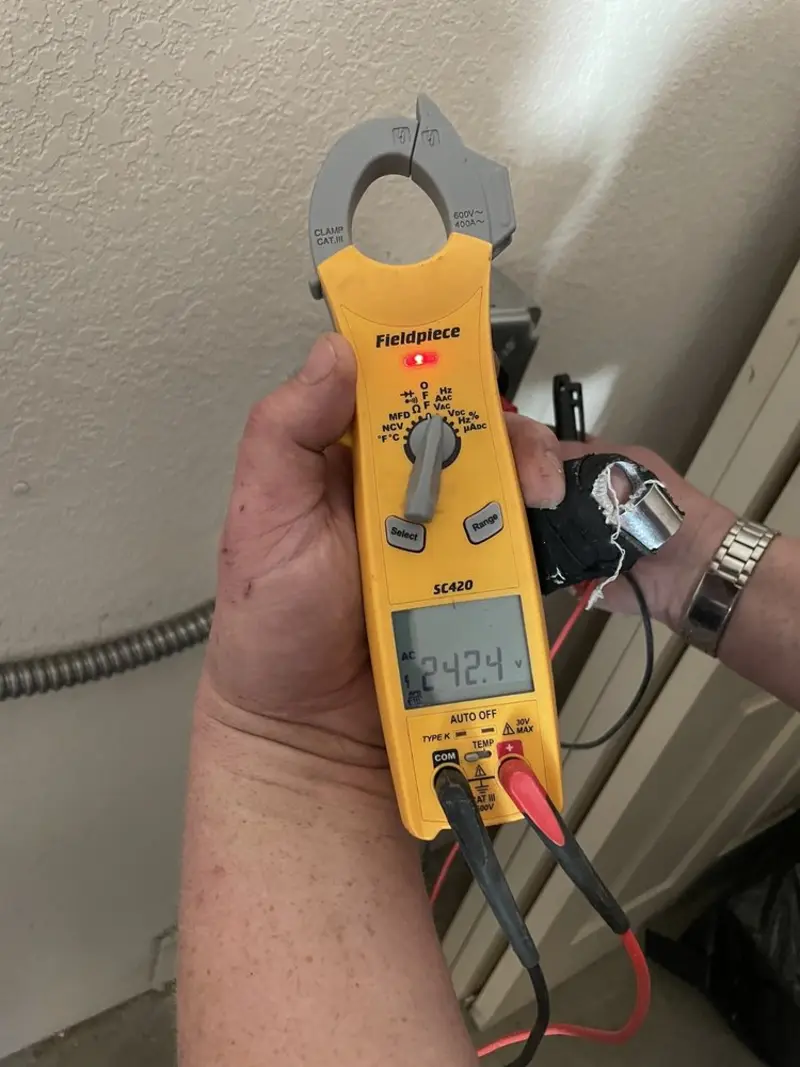 Voltage testing with clamp meter during Ceiling Fan Installation in Meraux